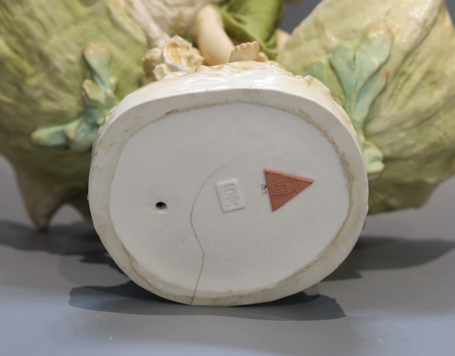 A Royal Dux porcelain centrepiece, modelled as a fisherwoman with scallop shells, height 41cm